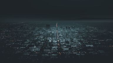 cached/dharmx_walls/aerial/a_city_with_lights_in_the_distance.jpg