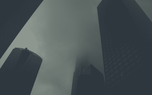 cached/dharmx_walls/apeiros/a_group_of_tall_buildings_with_fog.png