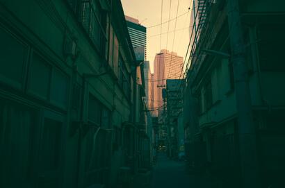 cached/dharmx_walls/architecture/a_city_alley_with_buildings_and_power_lines.jpg