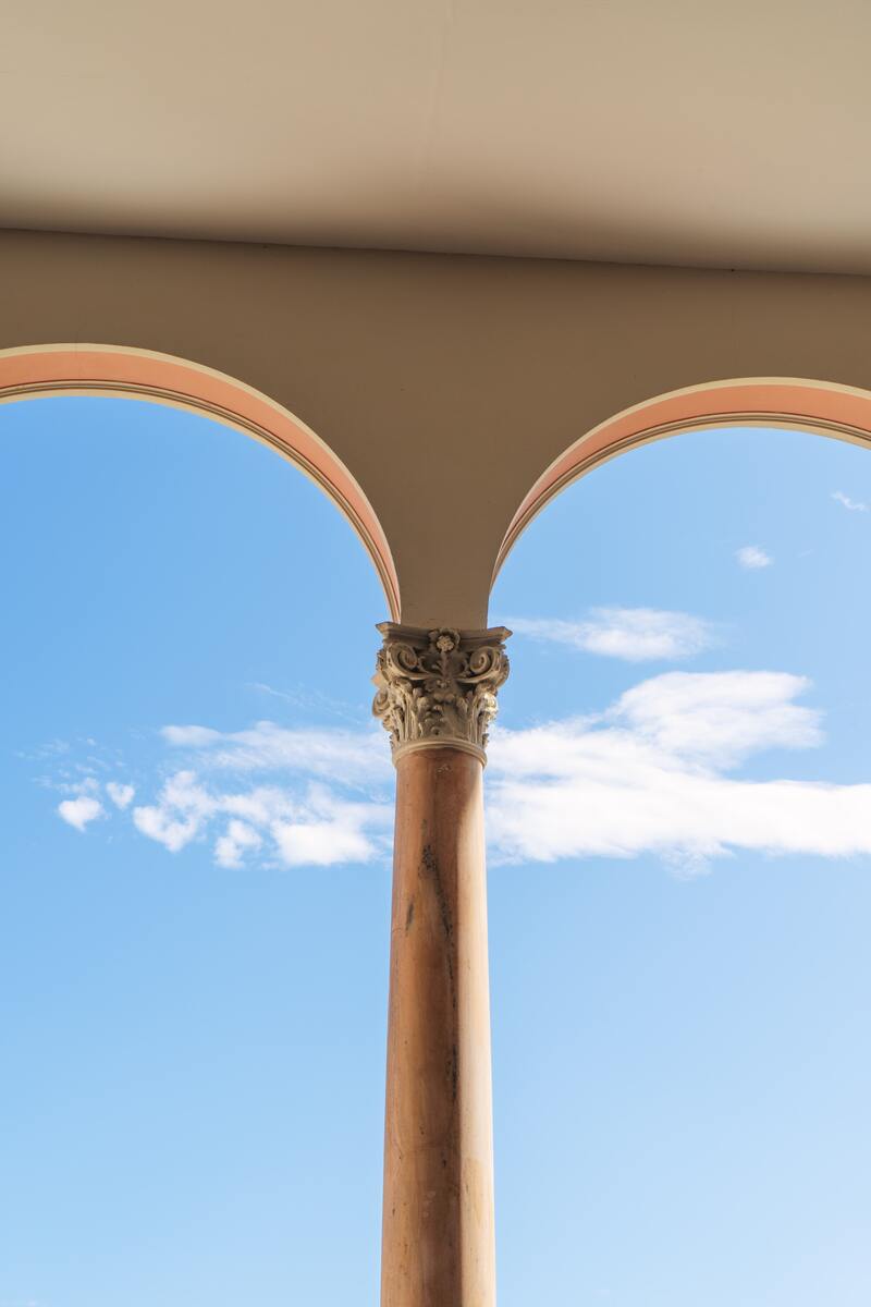 cached/dharmx_walls/architecture/a_pillar_with_a_stone_pillar_and_a_blue_sky.jpg