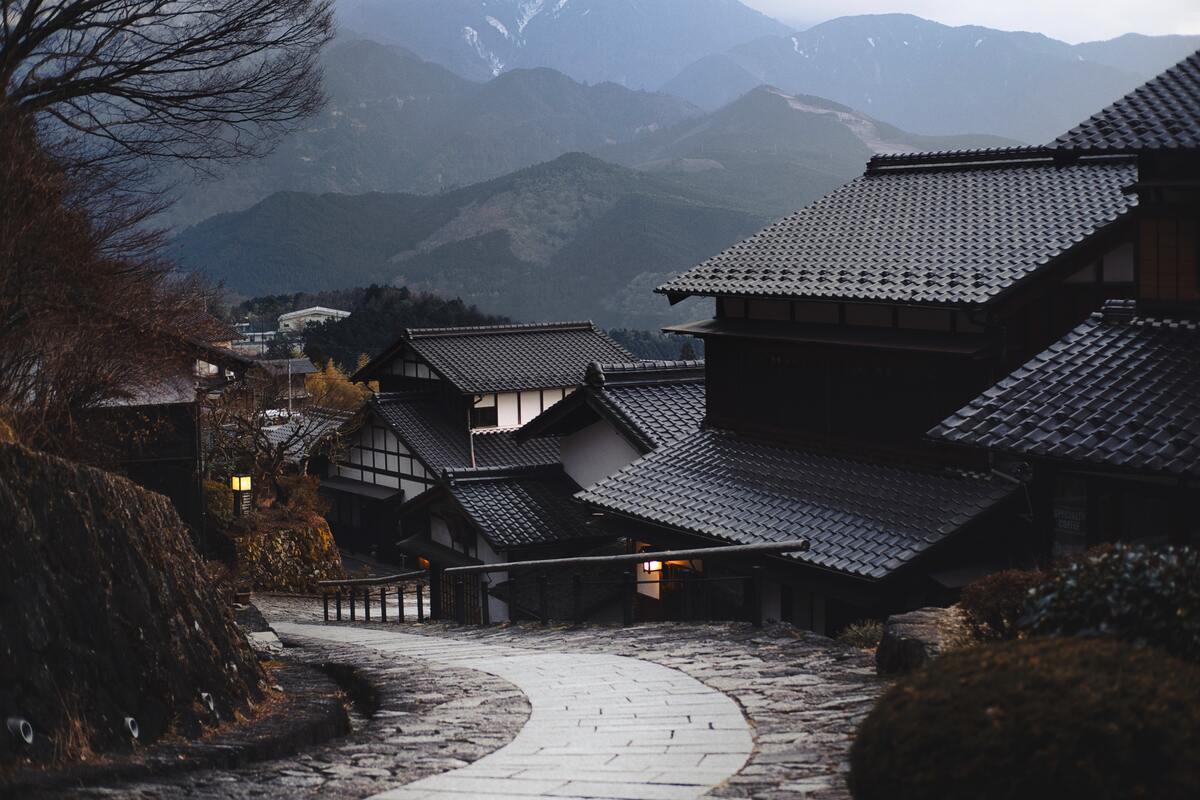 cached/dharmx_walls/architecture/a_stone_path_leading_to_a_building.jpg