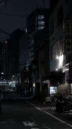 cached/dharmx_walls/centered/a_street_at_night_with_buildings_in_the_background.jpg