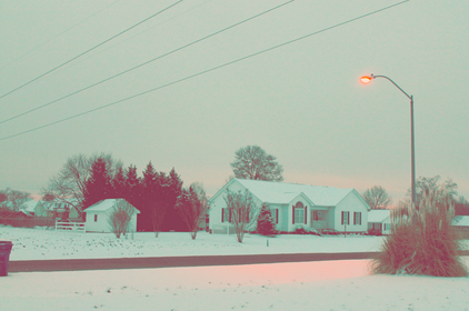 cached/dharmx_walls/cold/a_snow_covered_houses_and_a_street_light.png