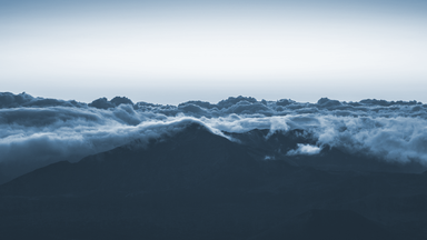 cached/dharmx_walls/cold/clouds_above_a_mountain.png