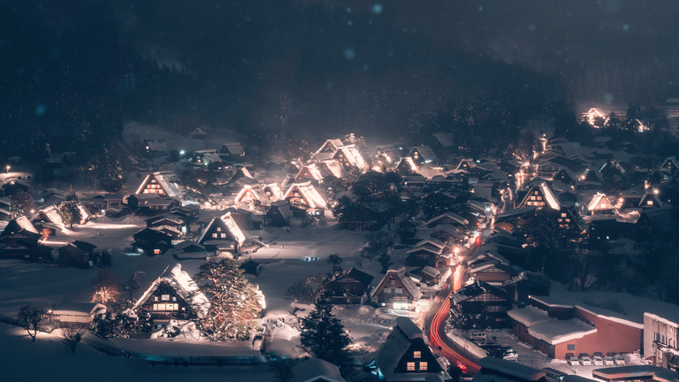 cached/dharmx_walls/digital/a_town_with_snow_covered_roofs_and_lights.png