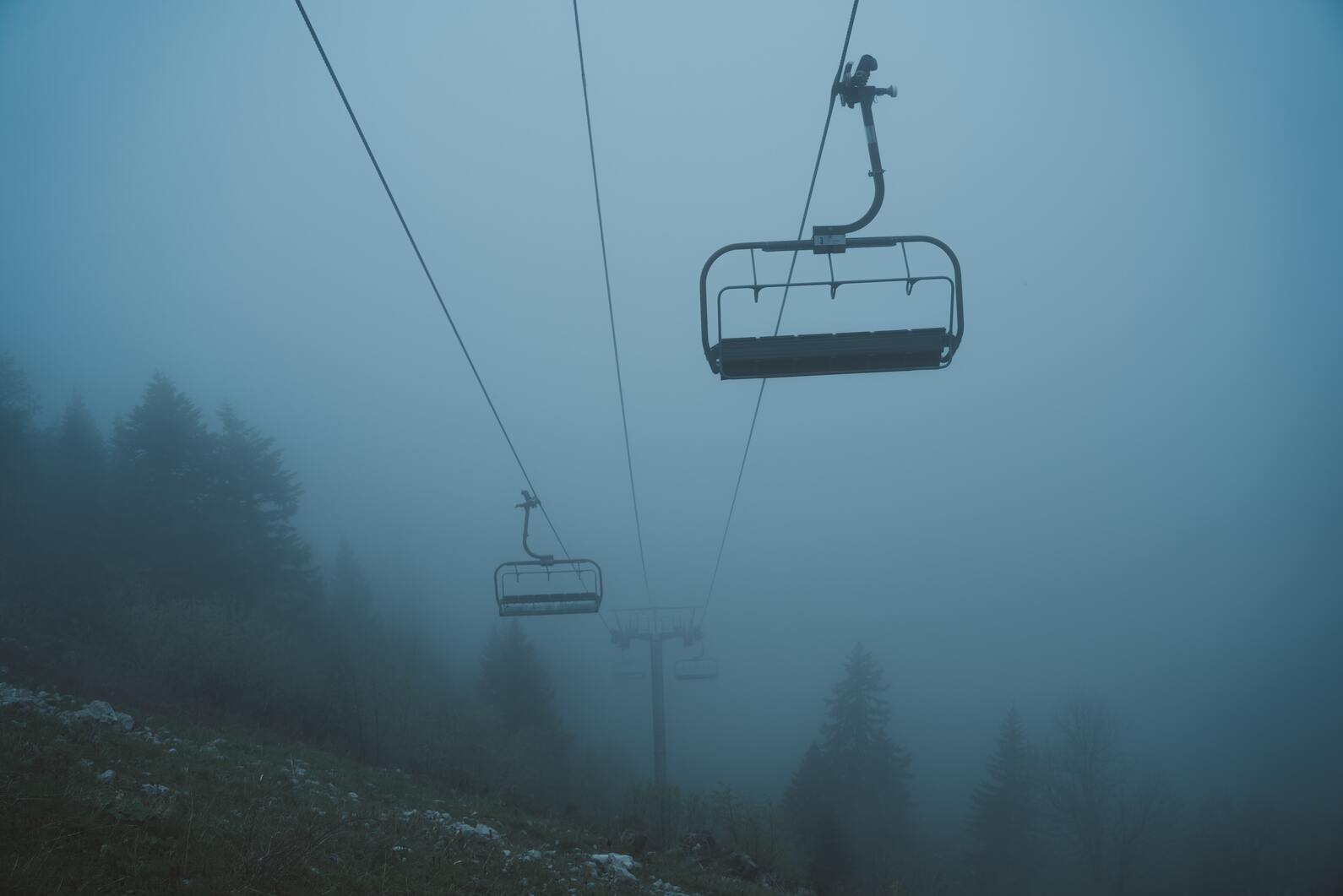 cached/dharmx_walls/dreamcore/a_ski_lift_with_a_chair_in_the_air.jpg