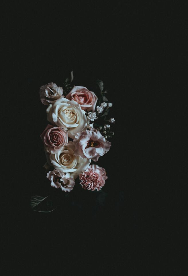 cached/dharmx_walls/flowers/a_bouquet_of_flowers_on_a_black_background.jpg