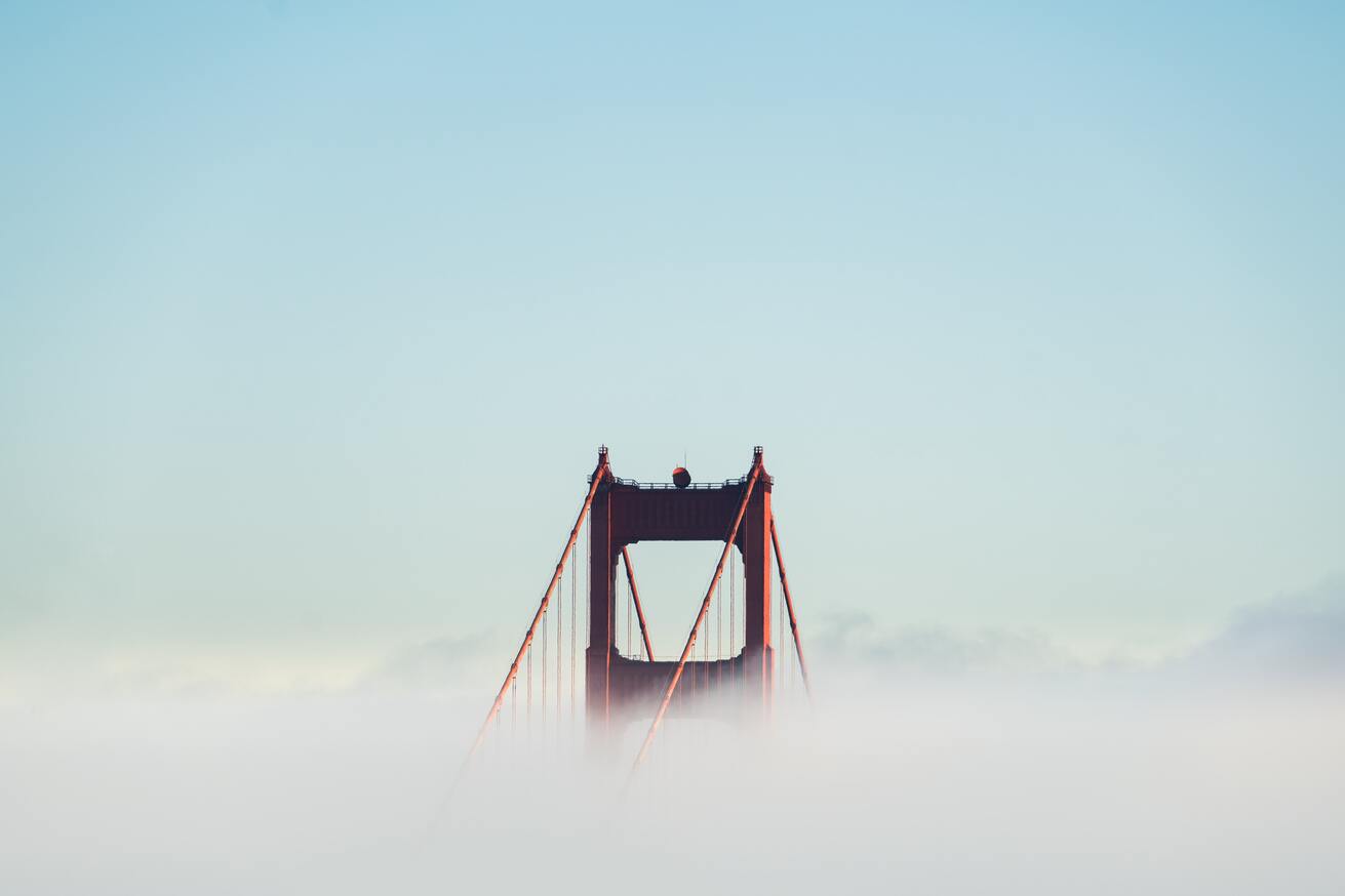 cached/dharmx_walls/fogsmoke/a_bridge_with_clouds_in_the_sky.jpg