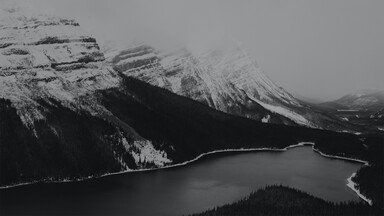 cached/dharmx_walls/monochrome/a_lake_surrounded_by_mountains.jpg