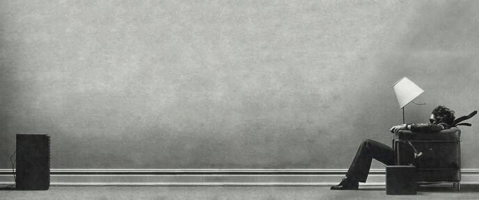 cached/dharmx_walls/monochrome/a_man_standing_in_a_corner_of_a_wall.jpg