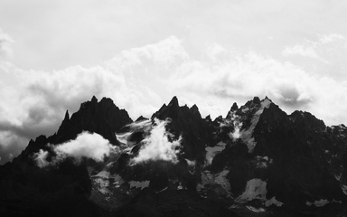 cached/dharmx_walls/monochrome/a_mountain_range_with_clouds.jpg