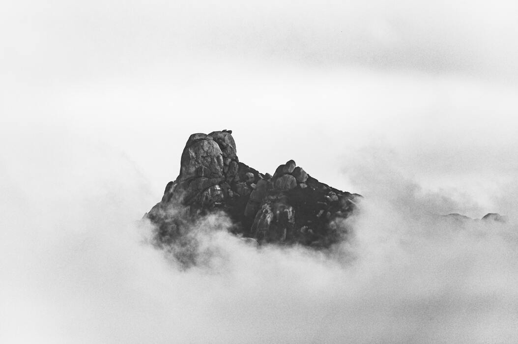 cached/dharmx_walls/monochrome/a_mountain_with_clouds_in_the_sky.jpg