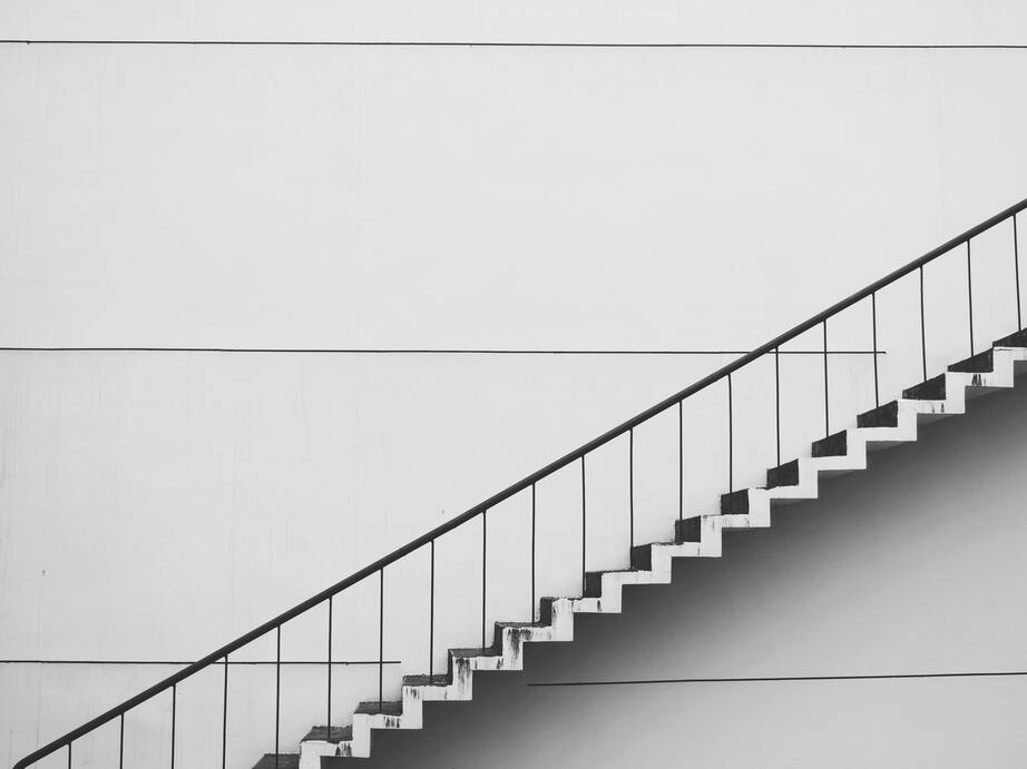 cached/dharmx_walls/monochrome/a_white_staircase_with_a_handrail.jpg