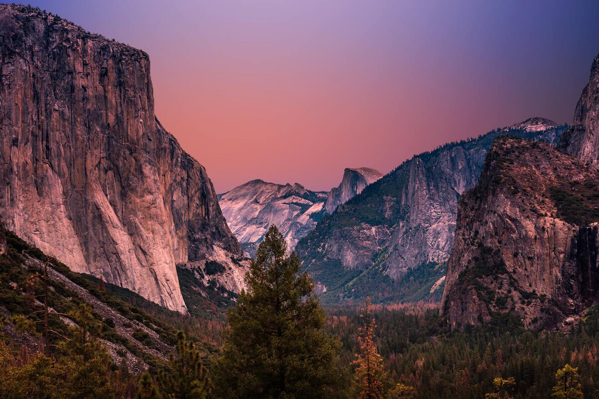 cached/dharmx_walls/mountain/a_mountain_range_with_trees_and_a_valley.jpg