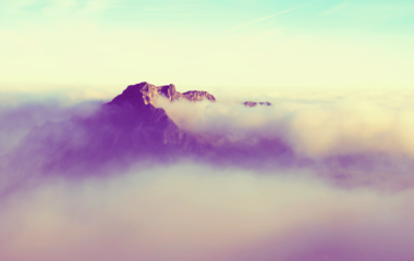 cached/dharmx_walls/mountain/a_mountain_with_clouds_above_it.png