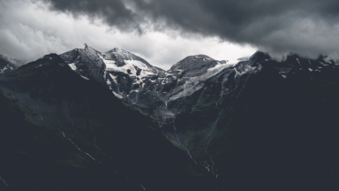 cached/dharmx_walls/mountain/a_snowy_mountain_tops_with_clouds_in_the_background.png