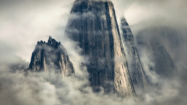 cached/dharmx_walls/nature/a_tall_mountain_with_clouds.jpg