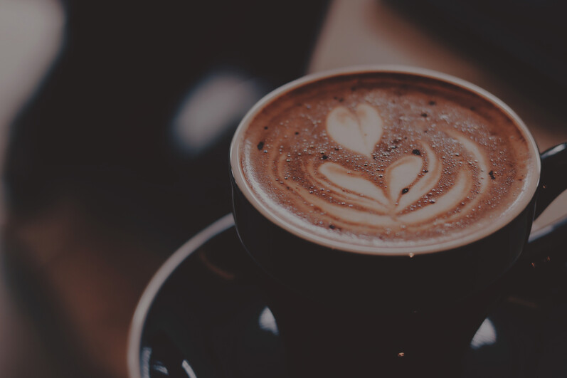 cached/dharmx_walls/unsorted/a_cup_of_coffee_with_a_heart_design_on_top.jpg