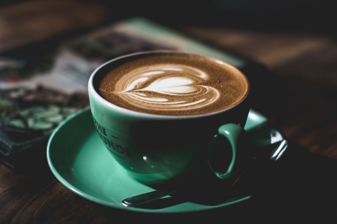 cached/dharmx_walls/unsorted/a_cup_of_coffee_with_a_heart_shaped_foam_in_it.jpg